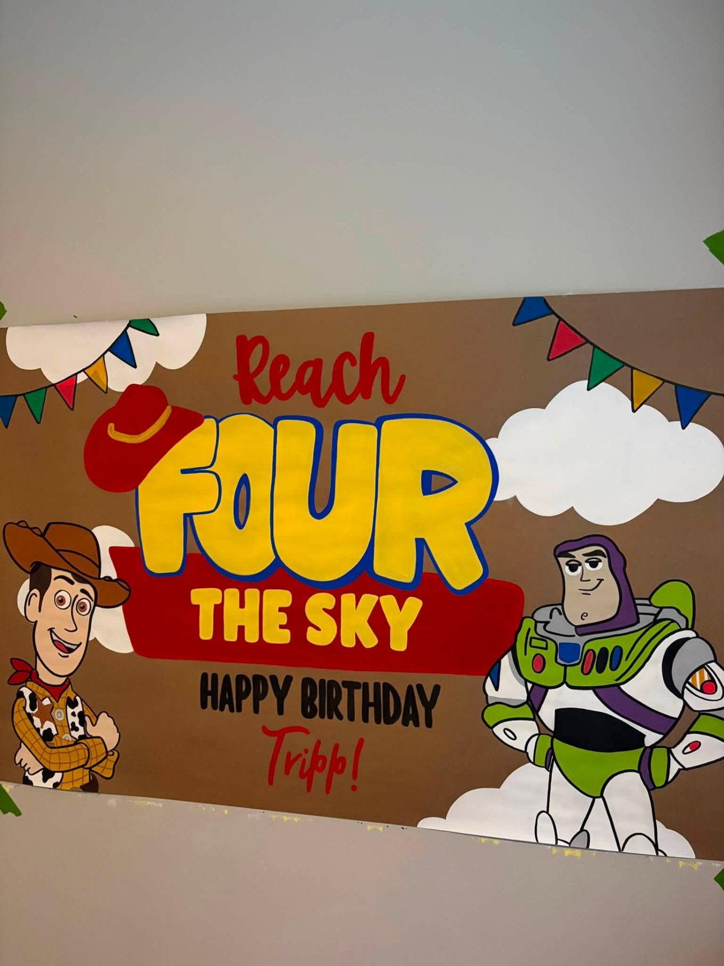 Toy Story inspired fourth birthday banner with Woody, Buzz Lightyear, clouds, and colorful bunting